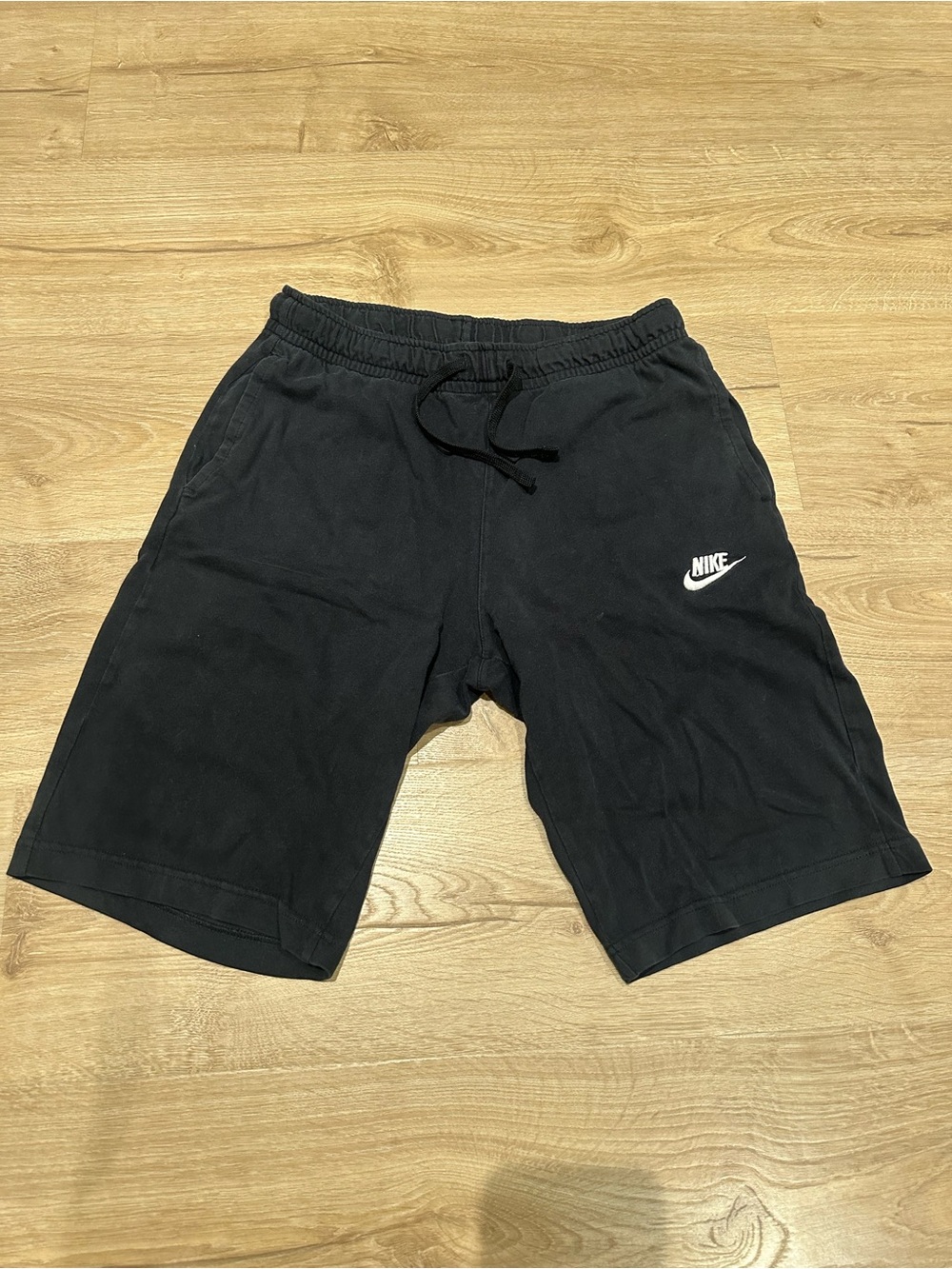 Nike Men's Black Athletic Shorts with White Swoosh